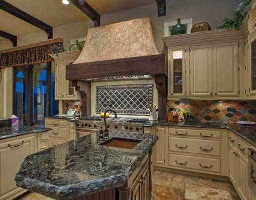 Spacious kitchen with exhaust fan and its walk in pantry